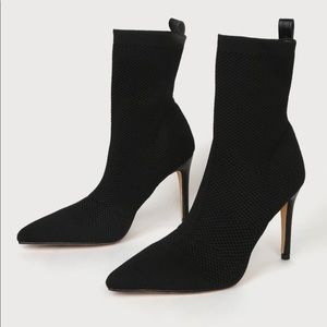 The Rhea Black Pointed-Toe High Heel Sock Booties